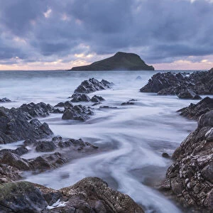 Worms Head at twilight off the coast of the Gower Peninsula, South Wales, UK. Autumn (November) 2021