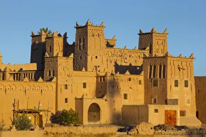 Moroccan Gallery: The 17th century Amerhidl kasbah illuminated at sunrise, Skoura, Morocco