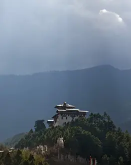 Prayer Flags Prints: The 17th century Jakar Dzong (fortress) stands in a commanding position overlooking the picturesque Chokhor