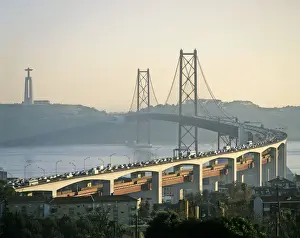 Jesus Christ Prints: The 25th of April bridge on a big traffic day and the huge statue of Cristo Rei, Lisbon