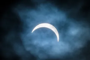 Moon Prints: 90% partial eclipse of the sun on a cloudy afternoom, Greater Sudbury, Ontario, Canada