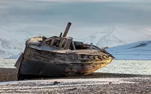 Svalbard Prints: Abandined old fishing boat on the beach at Skansbukta, Billefjorden, Svalbard, Norway