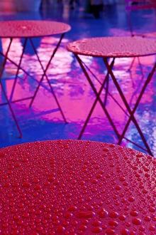 Images Dated 5th December 2011: Abstract water droplets on a red table under the Neon lights of 42nd Street, Times Square