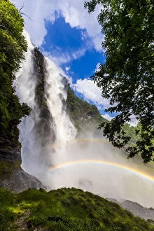 Acquafraggia Waterfall in spring with a rainbow. Valchiavenna, Valtellina, Lombardy