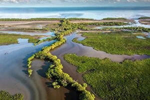 Images Dated 29th August 2023: Aerial of floodplain meeting the ocean, Bamurru Plains, Northern Territory, Australia