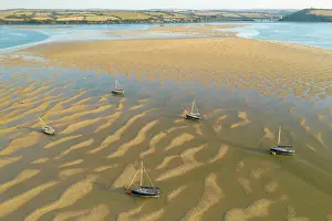 August Prints: Aerial image of boats stranded on sand bars in the Camel Estuary