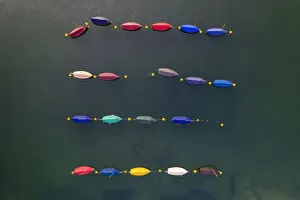 Aerial image of colourful boats moored in a harbour, Cornwall, England