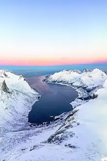 Day Dreaming Prints: Aerial panoramic of snowcapped mountains and coastal village of Bergsfjord at winter dawn