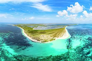 Leeward Islands Prints: Aerial panoramic view of 17-Mile Beach and lagoon washed by crystal blue sea