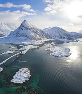 Moskenes Prints: Aerial panoramic view of snowy peak of Volanstinden and Fredvang bridge, Lofoten Islands