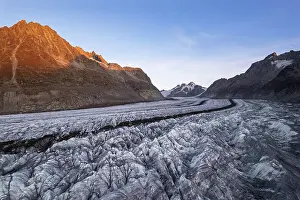 Cracks Prints: Aerial shot of Aletsch swiss glacier with crevasses and ice cracks at sunset