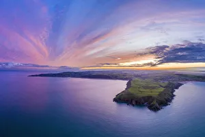Aerial sunrise view over Baggy Point towards Woolacombe, Morte Bay, North Devon, England