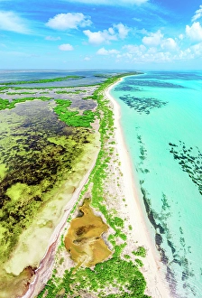 Leeward Islands Prints: Aerial view of 17-Mile Beach and tropical lagoon
