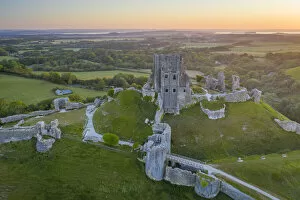 Images Dated 16th July 2021: Aerial view of the abandoned ruins of Corfe Castle at dawn, Dorset, England
