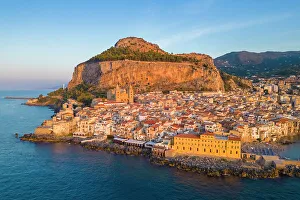 Aerial view of the ancient town of Cefalu, Unesco World Heritage site, at sunset. Palermo district, Sicily, Italy