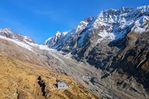 Larix Prints: Aerial view of the Anenhutte refuge in Lotschental valley in autumn, Valais, Switzerland