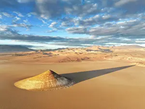 Shadow Prints: Aerial view of the Arita Cone (Cono de Arita) at sunrise in the Arizaro Salt Flat