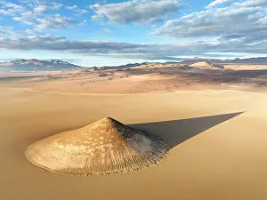 Shadow Prints: Aerial view of the Arita Cone (Cono de Arita) at sunrise in the Arizaro Salt Flat