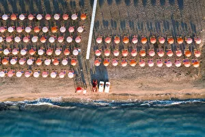 Images Dated 18th May 2021: Aerial view of beach umbrellas in a row on sand beach washed by waves, Vieste