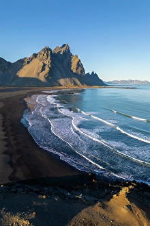 Black Prints: Aerial view of the black sand dunes in front of Vestrahorn mountain