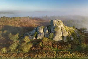 Aerial view of Blackingstone Rock on a misty winter morning, Dartmoor National Park, Devon, England