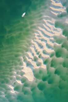 Abstract Prints: Aerial view of a boat moored on the Camel Estuary at low tide