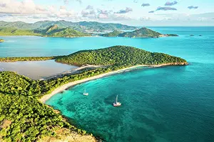 West Indies Prints: Aerial view of boats moored in a tropical lagoon nearby the green Pearns Point headland