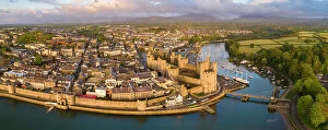 Images Dated 12th June 2023: Aerial view of Caernarfon Castle and town on a sunny spring evening, Caernarfon, North Wales, UK