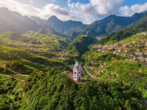 Roof Prints: Aerial view of Capelinha de Nossa Senhora de Fatima surrounded by terraced fields at sunrise