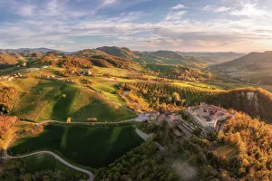 Castello Prints: Aerial view of the Castle of Montesegale at sunset