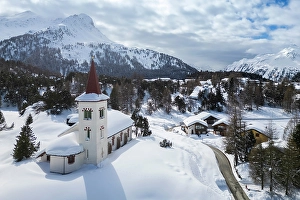 Bell Tower Prints: Aerial view of the Chiesa Bianca covered in snow