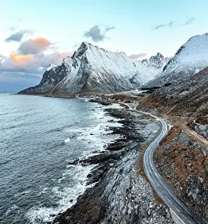 Road Trip Prints: Aerial view of a coastal road running by the cold fjord to the fishing village of Vikten
