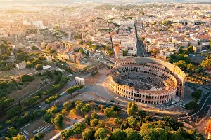 Ancient Monument Prints: Aerial view of Colosseum and Roman forums at sunset. Rome, Lazio, Italy