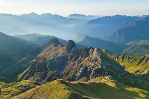 Trail Prints: Aerial view of the crest below Rifugio Benigni at sunrise looking towards Ornica