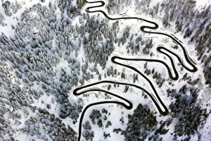 Mountain Pass Prints: Aerial view of curves of the Maloja pass after a snowfall, Maloja Pass, Bregaglia Valley