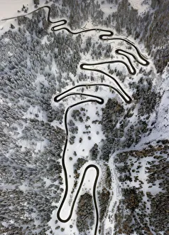 Earth From Above Prints: Aerial view of curves of the Maloja pass after a snowfall, Maloja Pass, Bregaglia Valley