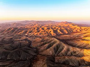 Sicasumbre Prints: Aerial view of desert mountains and volcanic landscape at sunset from Sicasumbre viewpoint