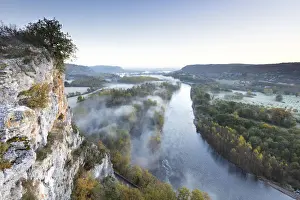 Aerial view of the Dordogne Valley & Dordogne river on a misty morning in autumn, Lot