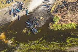 Okavango Prints: Aerial view of dugout canoes by river bank, Okavango Delta, Botswana, Africa
