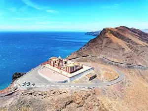 Red Rocks Prints: Aerial view of Entallada lighthouse on majestic cliffs overlooking the ocean