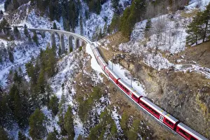 Viaduct Prints: Aerial view of the famous Bernina Express passing over the Landwasser Viaduct