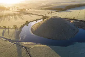 Wiltshire Prints: Aerial view of a flooded Silbury Hill on a frosty winter morning