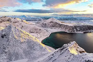 Finish Prints: Aerial view of the frozen Haukland beach from the snowy peak of Veggen mountain at dawn