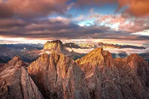 South Tyrol Prints: Aerial view of Furchetta, Sass Rigais and Sassolungo peaks under pink clouds at sunset