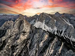 Climate Prints: Aerial view of Gametzalpenkopf and Croda Rossa D'Ampezzo peaks under a scenic sunset sky