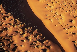 Dunes Prints: Aerial view of golden sand dunes at sunrise