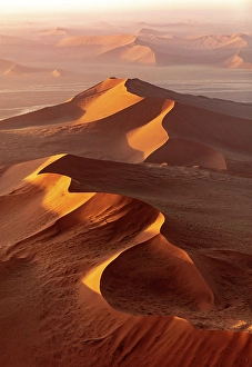 Dunes Prints: Aerial view of golden sand dunes at sunrise