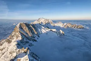 Valle Daosta Prints: Aerial view of Grandes Jorasses and Mont Blanc in background during sunrise, Courmayeur