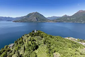 Aerial Photography Prints: Aerial view of the green hill and castle overlooking Varenna surrounded by Lake Como