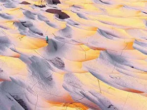 Catamarca Prints: Aerial view of a hiker standing in pumice stone landscape